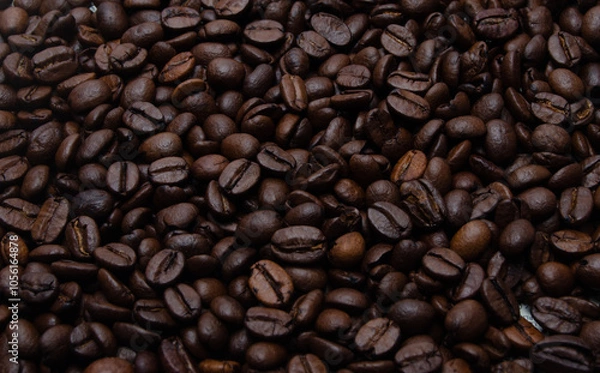 Obraz A pile of coffee beans. All stacked together, waiting to be ground into a delicious cup of coffee. A close-up shot of roasted coffee beans. Different types of delicious coffee beans.