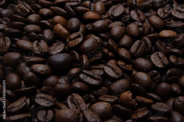 Obraz A pile of coffee beans. All stacked together, waiting to be ground into a delicious cup of coffee. A close-up shot of roasted coffee beans. Different types of delicious coffee beans.