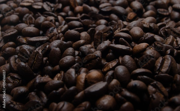 Obraz A pile of coffee beans. All stacked together, waiting to be ground into a delicious cup of coffee. A close-up shot of roasted coffee beans. Different types of delicious coffee beans.