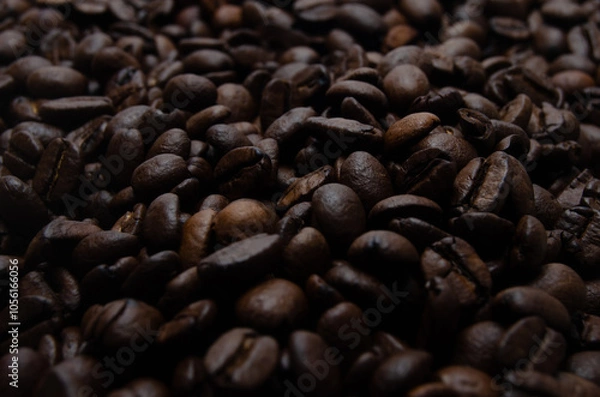 Obraz A pile of coffee beans. All stacked together, waiting to be ground into a delicious cup of coffee. A close-up shot of roasted coffee beans. Different types of delicious coffee beans.