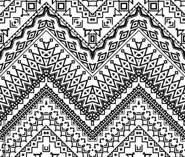 Fototapeta Seamless hand drawn chevron pattern with ethnic and tribal ornament. Vector black and white fashion illustration