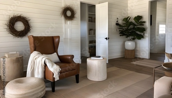Fototapeta Cozy reading nook with a wingback chair and a plush blanket for ultimate comfort and relaxation