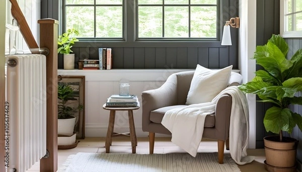 Fototapeta Cozy reading nook with a comfortable armchair surrounded by an inviting collection of books