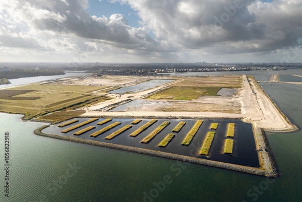 Obraz Amsterdam’s Strandeiland, an artificial island under development in IJburg. This future sustainable housing district features new land, designed for eco-friendly urban living. Aerial view.