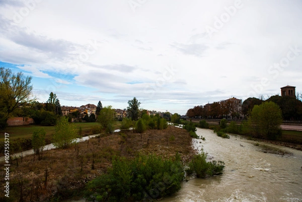 Fototapeta A rushing river in winter floods the city, creating stunning views and highlighting the raw power of nature's elements.