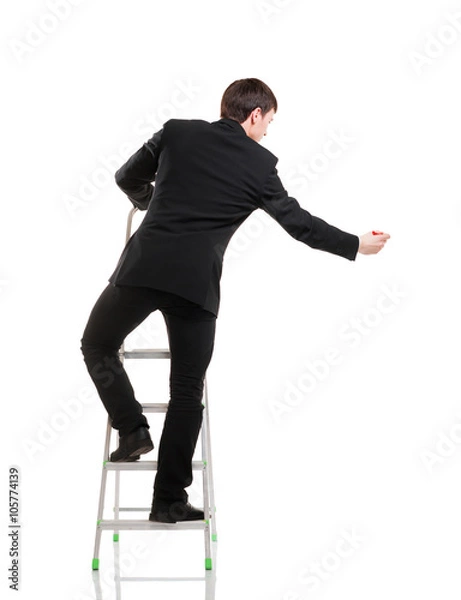 Fototapeta Successful and smart businessman writing imaginary text