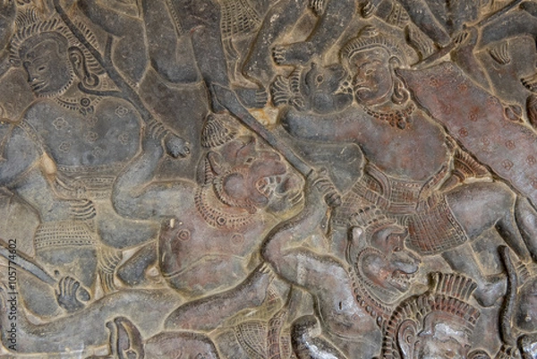 Fototapeta Bas relief of the battle between Gods and Demons, Angkhor Wat, C