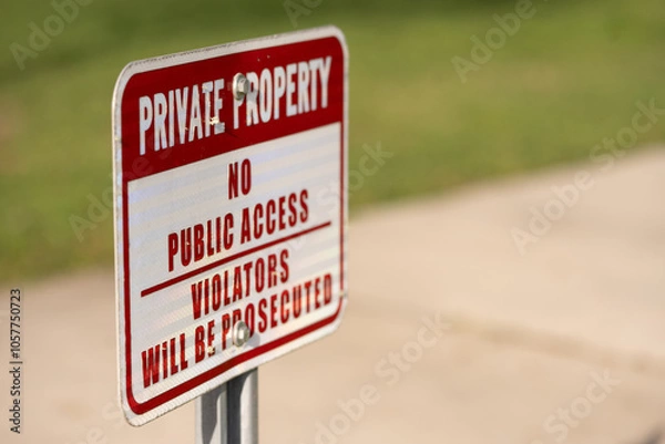 Obraz Rectangle image of a red and white PRIVATE PROPERTY, NO PUBLIC ACCESS, VIOLATORS WILL BE PROSECUTED sign  screwed to a metal post, side view with copy space