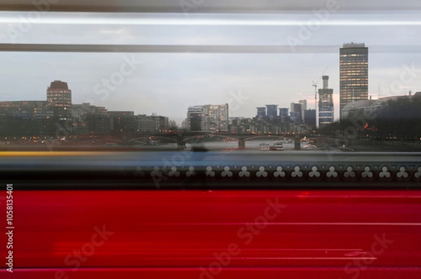 Fototapeta View of London bridge through passing red bus