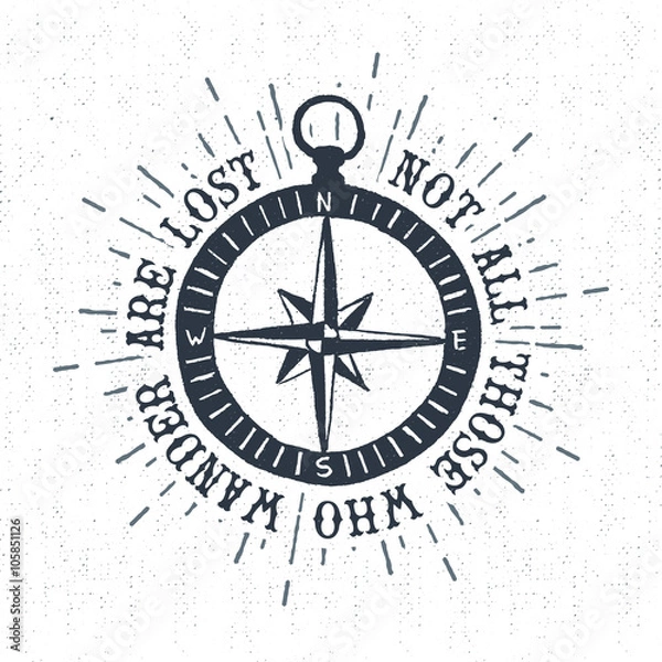 Fototapeta Hand drawn textured vintage label, retro badge with compass rose vector illustration and "Not all those who wander are lost" inspirational lettering.