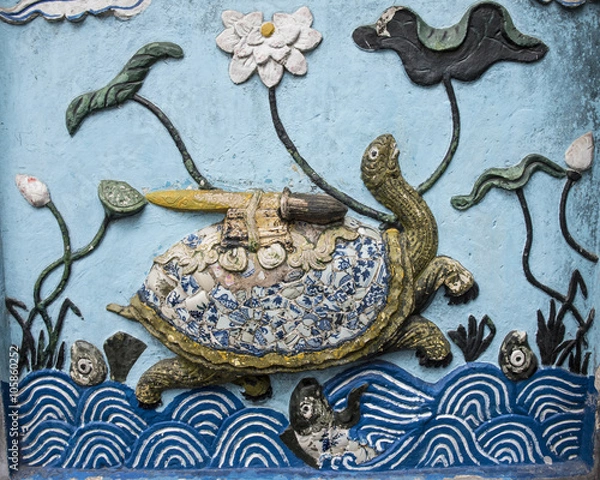Fototapeta Bas relief of the golden tortoise and the magic sword of the myt