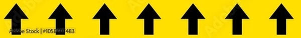 Obraz Black arrows in continuous order on yellow background. Arrows direction sign horizontal tape. Flow direction tape. A long horizontal stripe. 