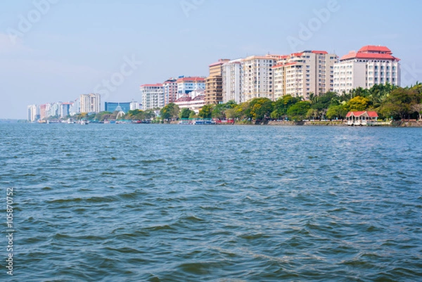 Obraz Ernakulam, the mainland part of the Kochi (Cochin) city, a view on new residential buildings from a ferry coming from Fort Kochi, Kerala, India