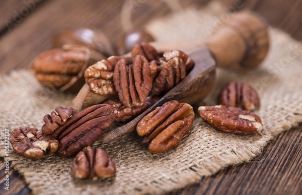 Fototapeta Some Pecan Nuts (selective focus)