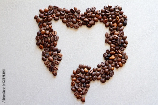 Fototapeta Intestines shape made of coffee beans, impact of coffee on bowels health, creative concept
