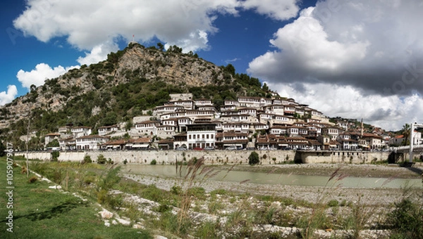 Fototapeta famous berat, city of a thousand windows, wide panorama with blue sky and clouds
