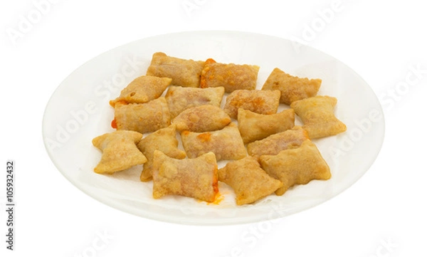 Obraz Bite size pepperoni pizza rolls on a white plate isolated on a white background.
