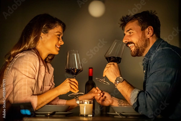 Fototapeta Romantic Candlelit Dinner with Wine for Couple at Restaurant