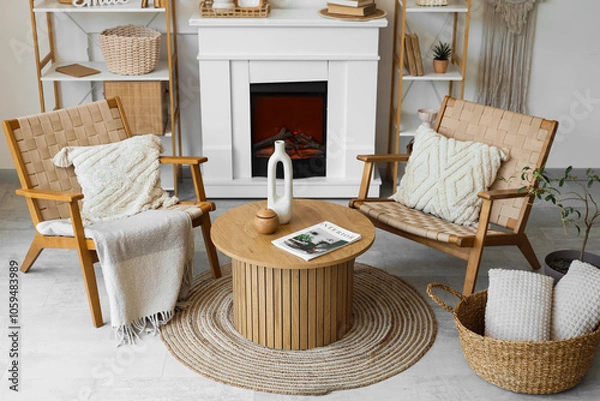 Obraz Armchairs, coffee table and fireplace in living room