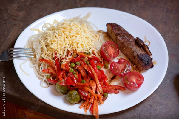 Obraz Plate of Spaghetti with Grated Cheese, Sautéed Vegetables, and Grilled Meat