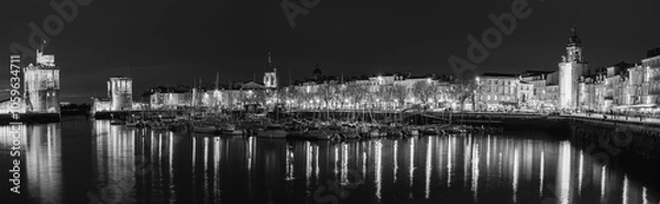 Obraz Beautiful illuminated cityscape of the old harbor of La Rochelle at night.