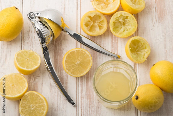 Obraz Lemon Press with Lemons and Juice in Glass