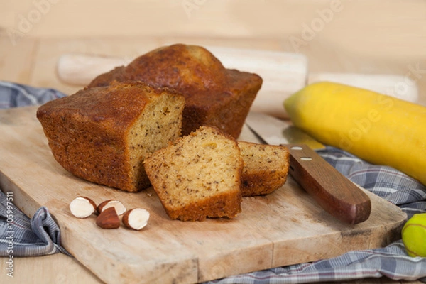 Obraz Homemade banana bread sliced on a table . rustic style