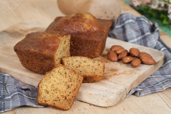Obraz Homemade banana bread sliced on a table . rustic style