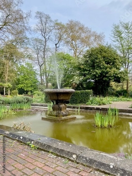 Obraz Beautiful public English Garden with a fountain and pond.  Taken on a sunny day.  