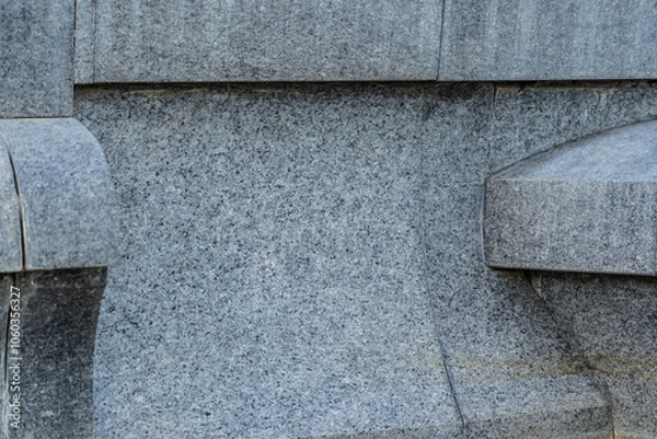 Fototapeta Granite and marble structure. The foundation of the fountain in the city