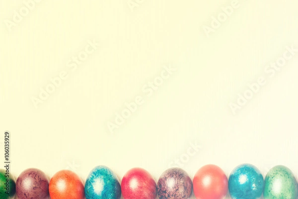 Obraz Easter eggs isolated on white wooden background