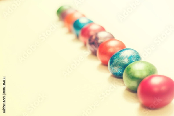 Obraz Easter eggs isolated on white wooden background