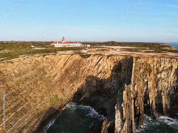 Fototapeta Aerial view of the Farol do Cabo Sardão lighthouse at the edge of the steep cliff. in Portugal