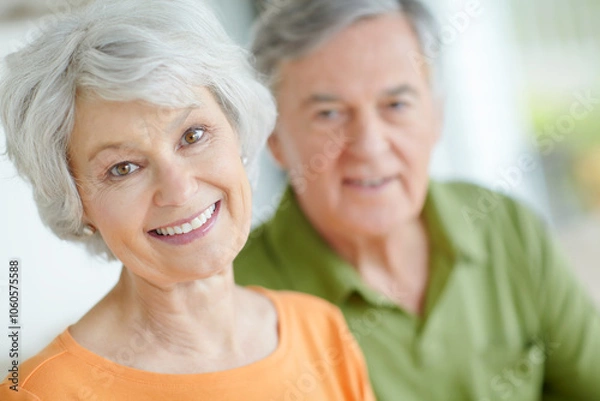 Obraz Senior couple, relax and portrait with smile in home for retirement, connection and romantic bonding. Elderly woman, man and face with support in house for peace, marriage or love on weekend together