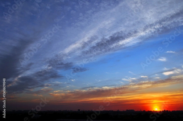 Fototapeta sunset sky with sun and clouds