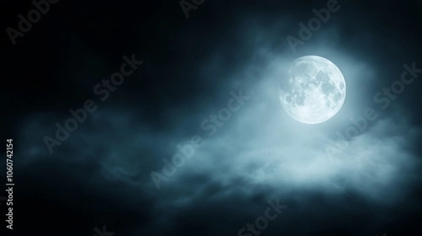 Fototapeta A captivating full moon shines through dark clouds, creating a mysterious and atmospheric night sky scene.