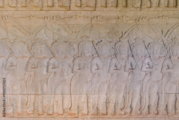 Fototapeta Scene of the Churning of the Milk Ocean carvings status on the wall of Angkor wat temple, world heritage, Siem Reap, Cambodia
