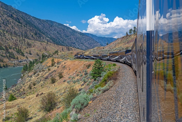 Fototapeta Rocky Mountaineer train by Fraser River between Vancouver and Kamloops, British Columbia, Canada.