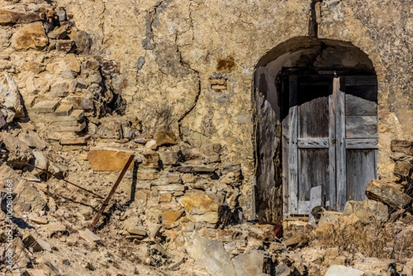 Fototapeta Abandoned ruins of the ghost town of Craco. A city abandoned due to an earthquake in the late 20th century. Province of Matera, Basilicata, Italy