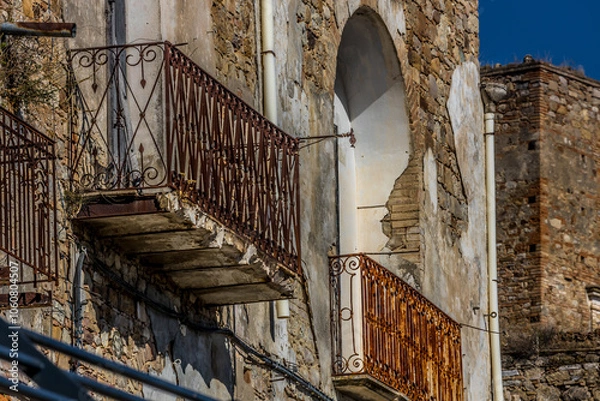 Fototapeta Abandoned ruins of the ghost town of Craco. A city abandoned due to an earthquake in the late 20th century. Province of Matera, Basilicata, Italy