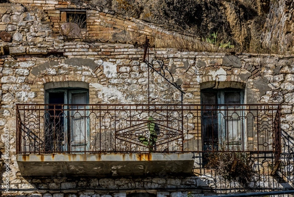 Fototapeta Abandoned ruins of the ghost town of Craco. A city abandoned due to an earthquake in the late 20th century. Province of Matera, Basilicata, Italy