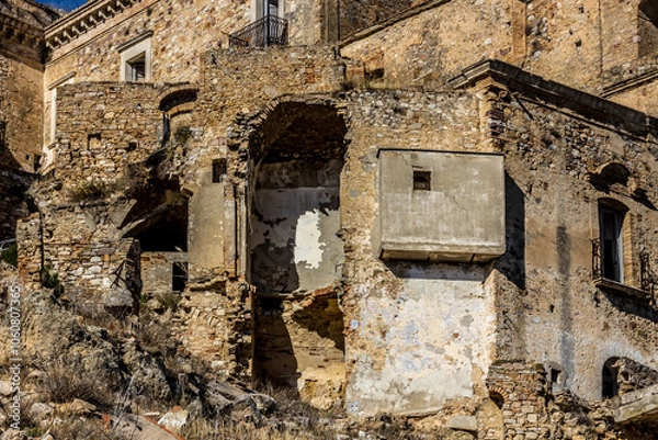 Fototapeta Abandoned ruins of the ghost town of Craco. A city abandoned due to an earthquake in the late 20th century. Province of Matera, Basilicata, Italy