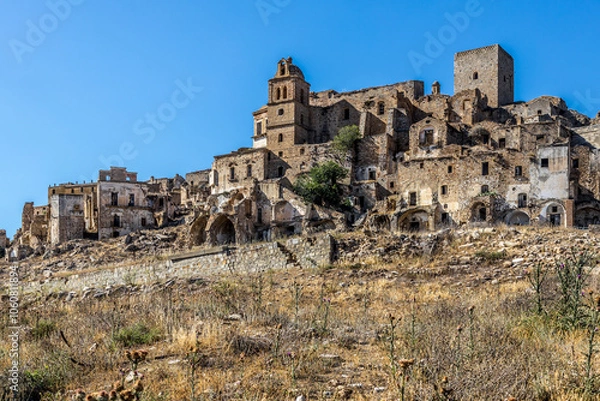 Fototapeta Abandoned ruins of the ghost town of Craco. A city abandoned due to an earthquake in the late 20th century. Province of Matera, Basilicata, Italy
