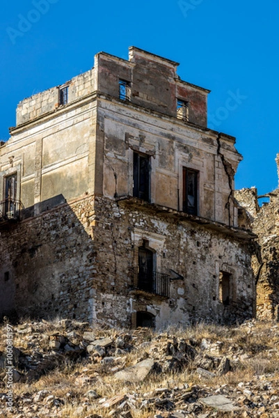 Fototapeta Abandoned ruins of the ghost town of Craco. A city abandoned due to an earthquake in the late 20th century. Province of Matera, Basilicata, Italy