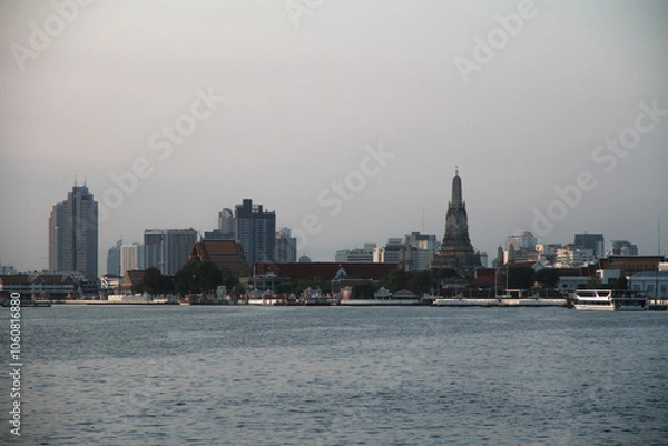 Fototapeta skyline of bangkok, thailand with famous wat arun temple and wat kanlayanamit temple
