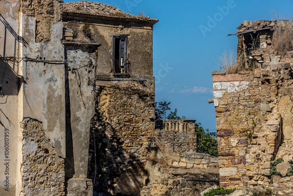 Fototapeta Abandoned ruins of the ghost town of Craco. A city abandoned due to an earthquake in the late 20th century. Province of Matera, Basilicata, Italy