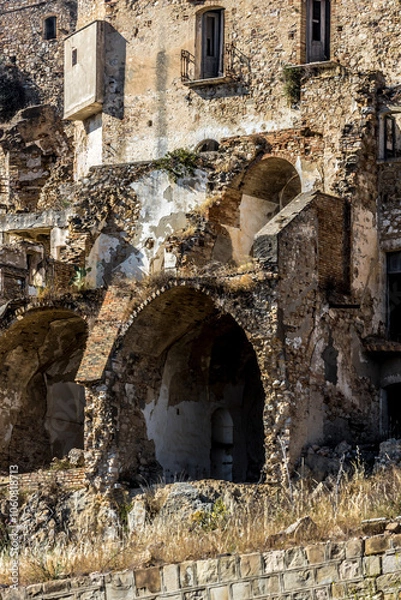 Fototapeta Abandoned ruins of the ghost town of Craco. A city abandoned due to an earthquake in the late 20th century. Province of Matera, Basilicata, Italy