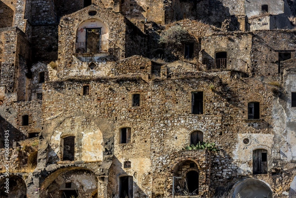 Fototapeta Abandoned ruins of the ghost town of Craco. A city abandoned due to an earthquake in the late 20th century. Province of Matera, Basilicata, Italy
