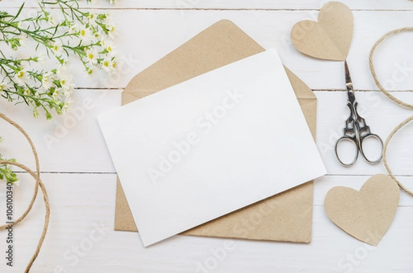 Fototapeta Blank white greeting card with brown envelop