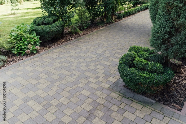 Fototapeta Beautiful summer garden with a walkway winding its way through